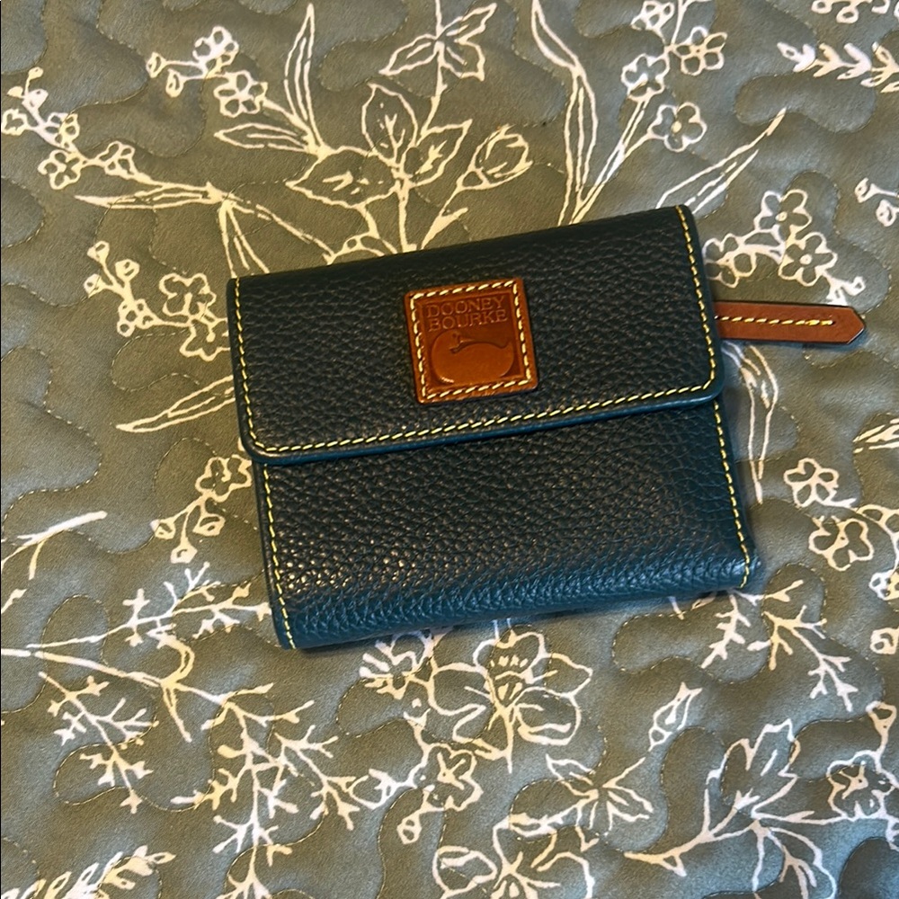 Dooney & Bourke Pebble Grain Small Flap Wallet.
TEAL